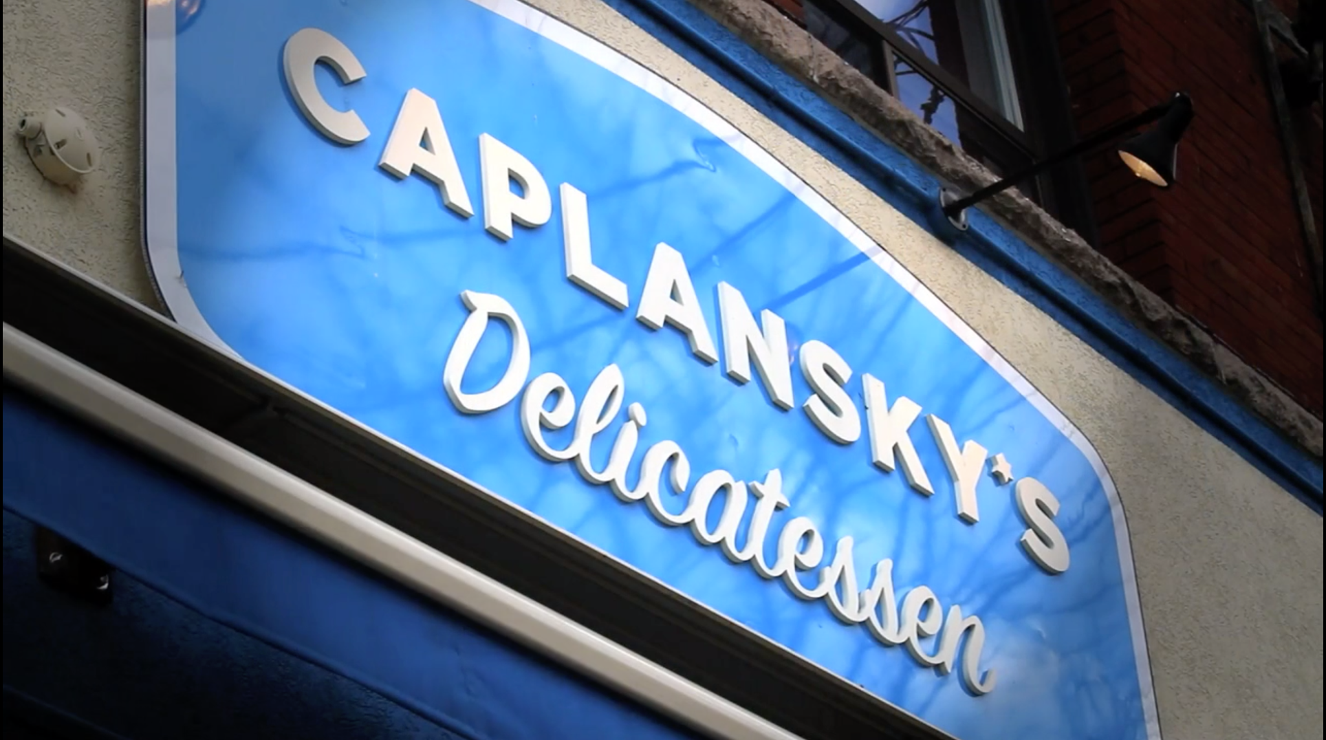 Load video: Inside a busy Toronto deli selling smoked meat sandwiches. Shots of sandwiches being made and eaten. Directed, cut and shot by Ron Grebler.
