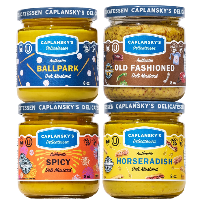 Four Caplansky's mustard jars